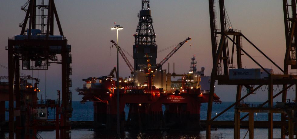 Dock with West Bollsta semi-submersible drilling rig (a vessel in the Oil service segment) on the Tenerife island during sunset